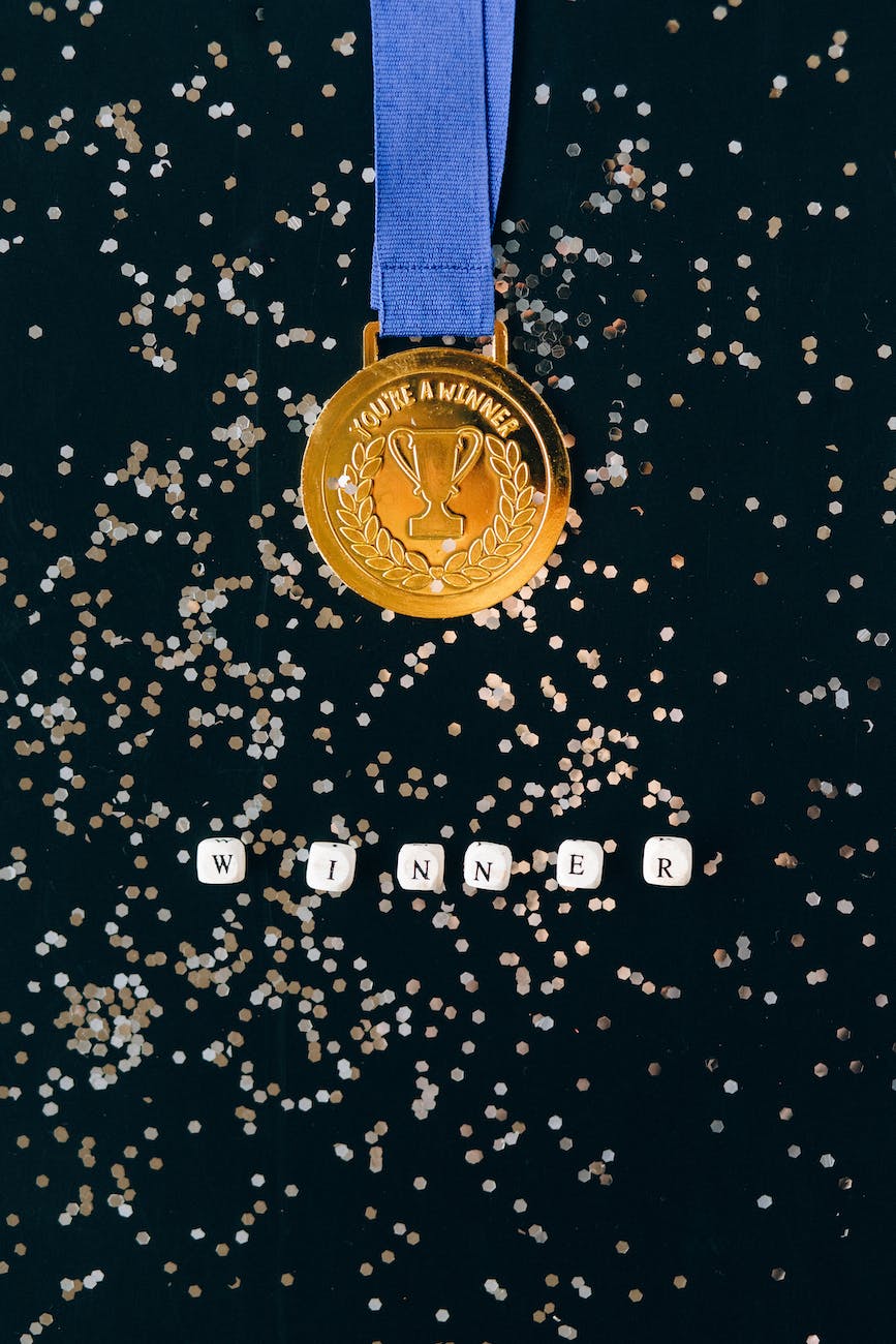 close up shot of a gold medal on a black surface