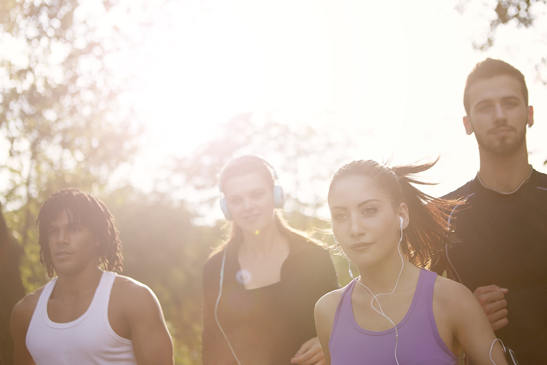 happy diverse sportspeople jogging in park