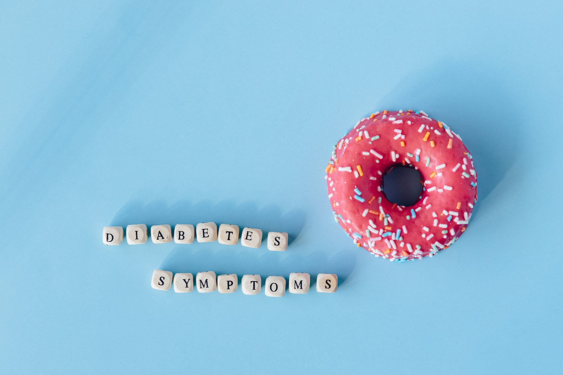 a doughnut and a message over blue surface