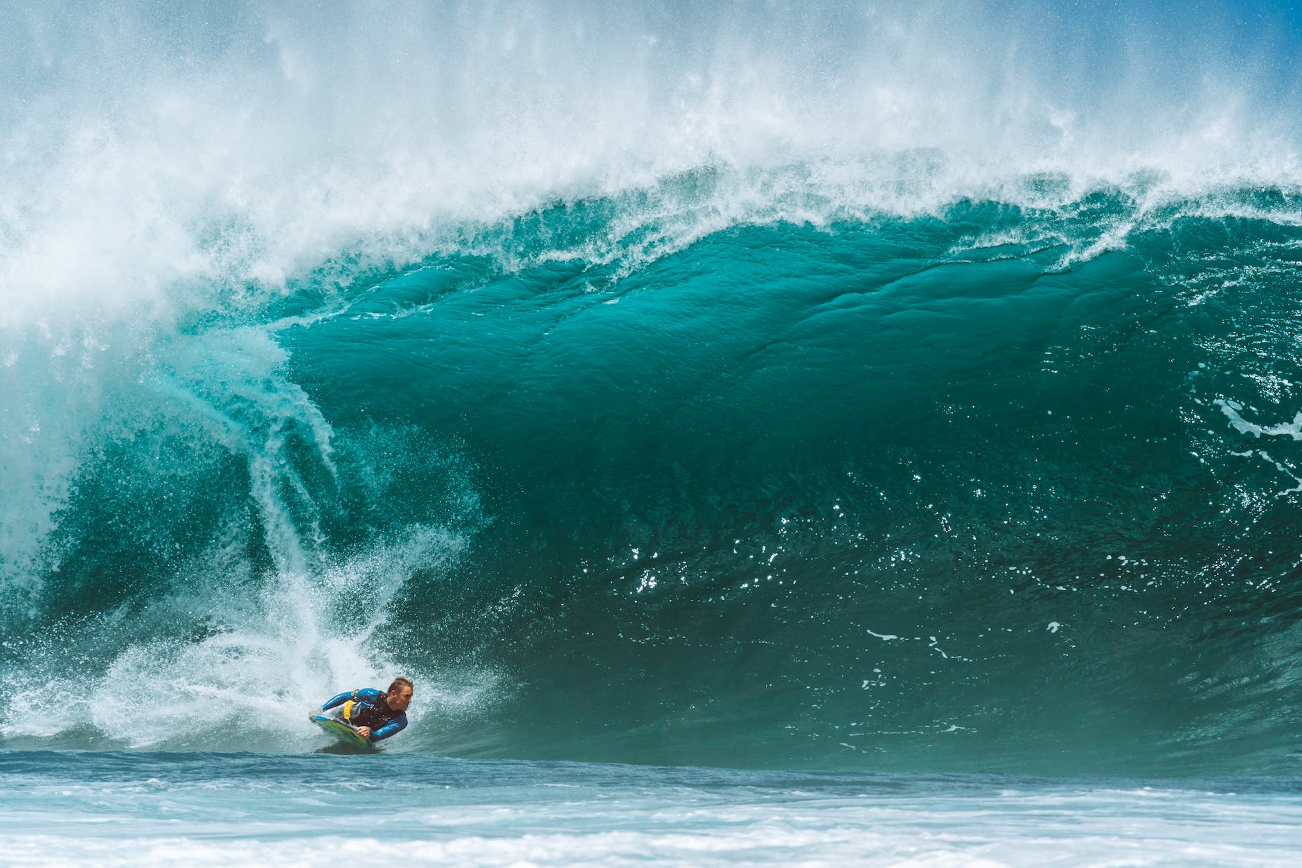 fearless surfer balancing on big wave of ocean