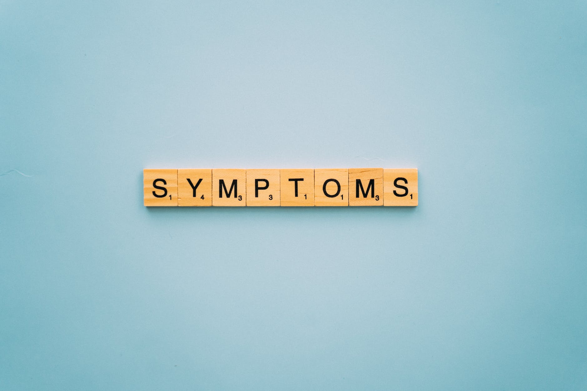 word symptoms in scrabble tiles