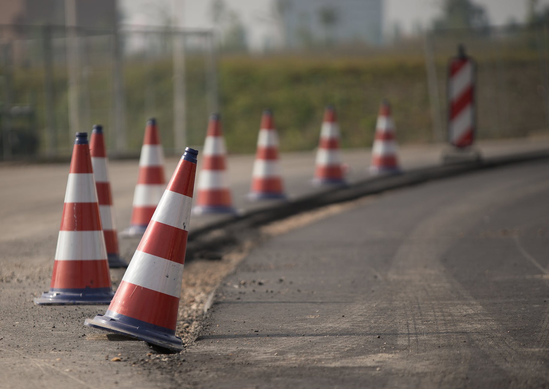 traffic cones in row on road edge